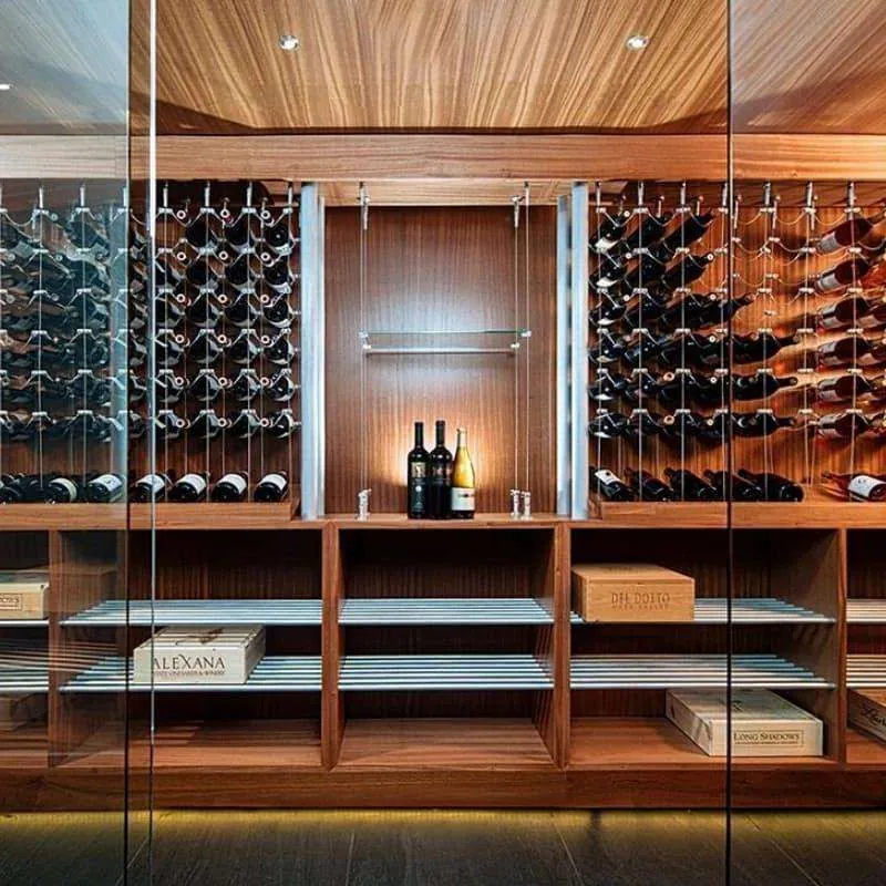 RM-003 warm wood wall cabinetry, glass-front display bays, bottle racks and lower storage shelves